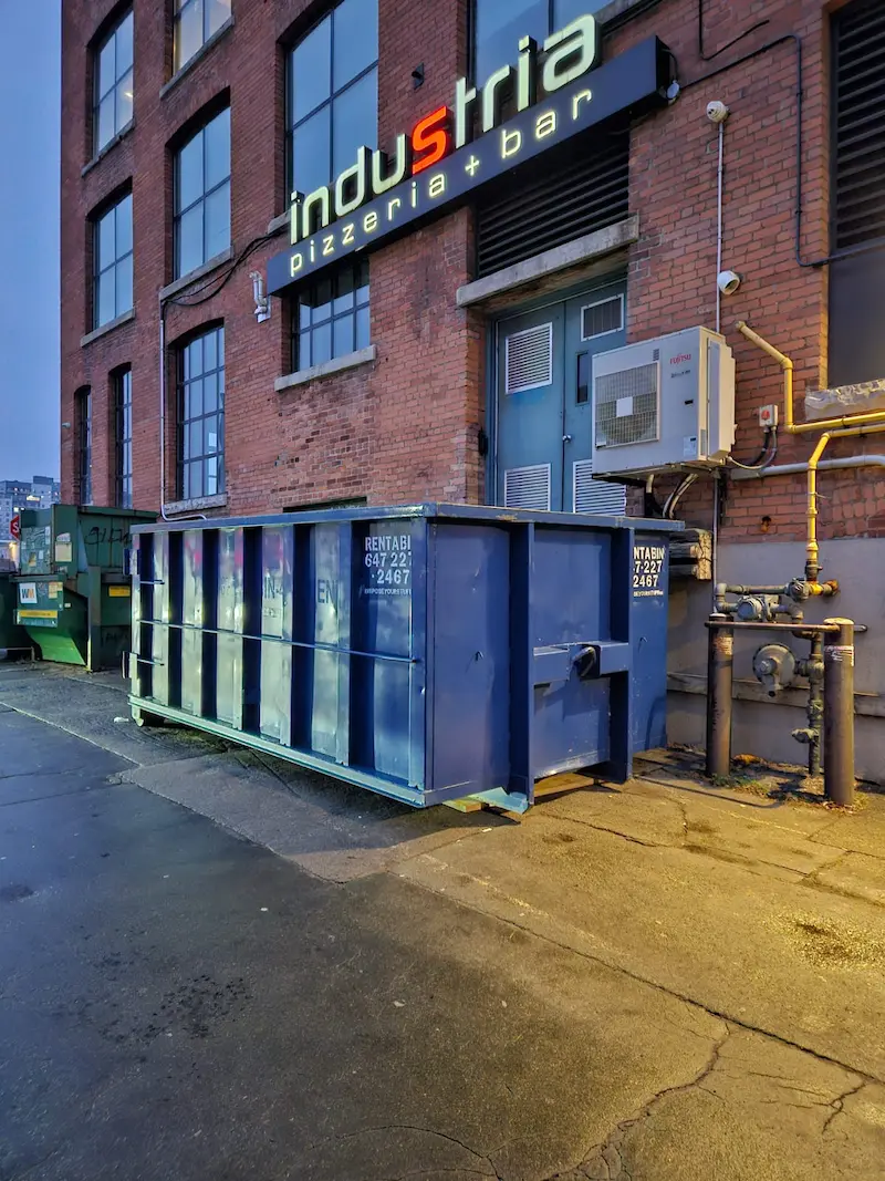 Measuring dumpster clearance on Halton Hills sidewalk
