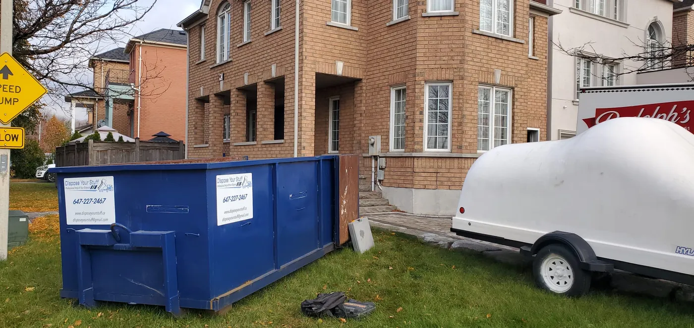 Junk removal crew working through a multi-floor Brampton home