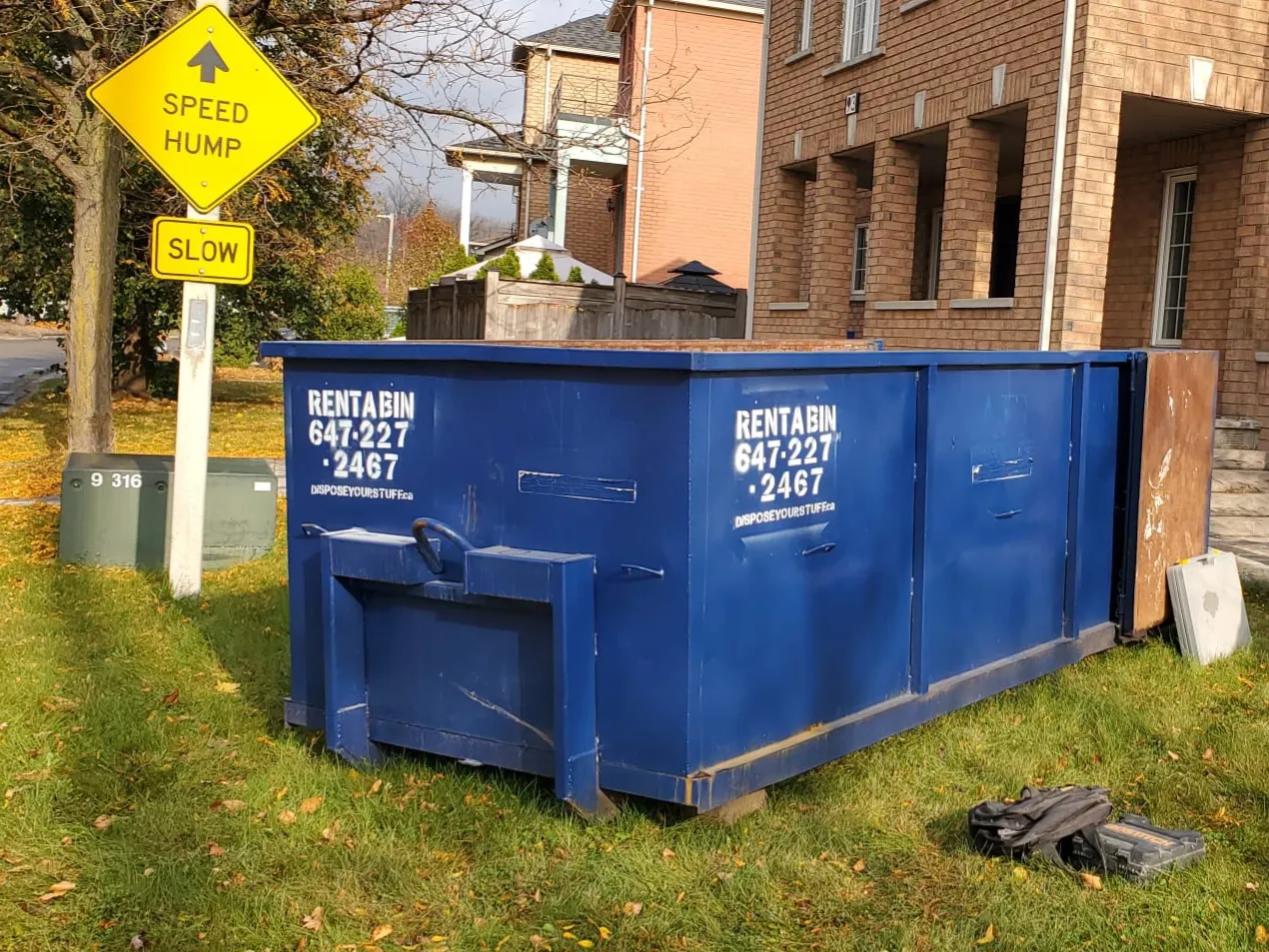 Large blue bin in residential area