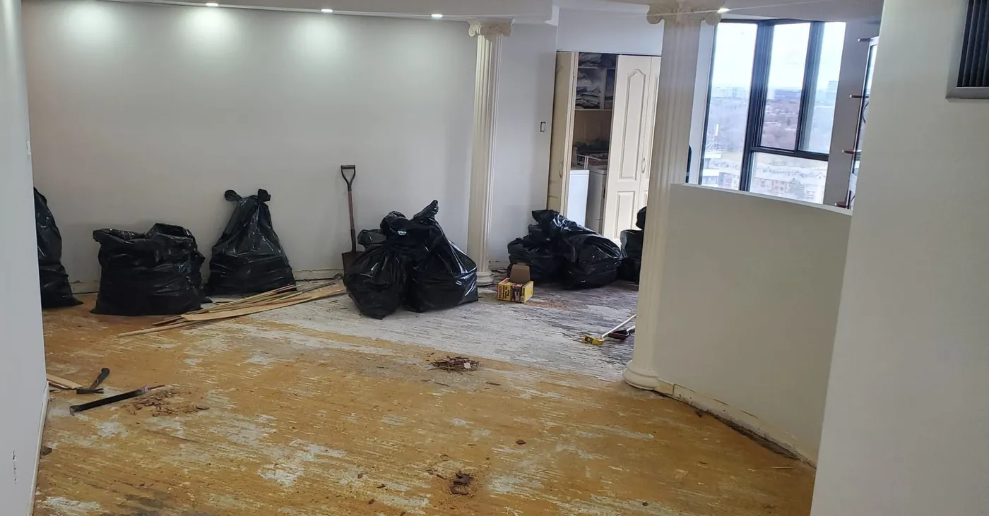 Interior of a Milton home mid-renovation with items staged for junk removal