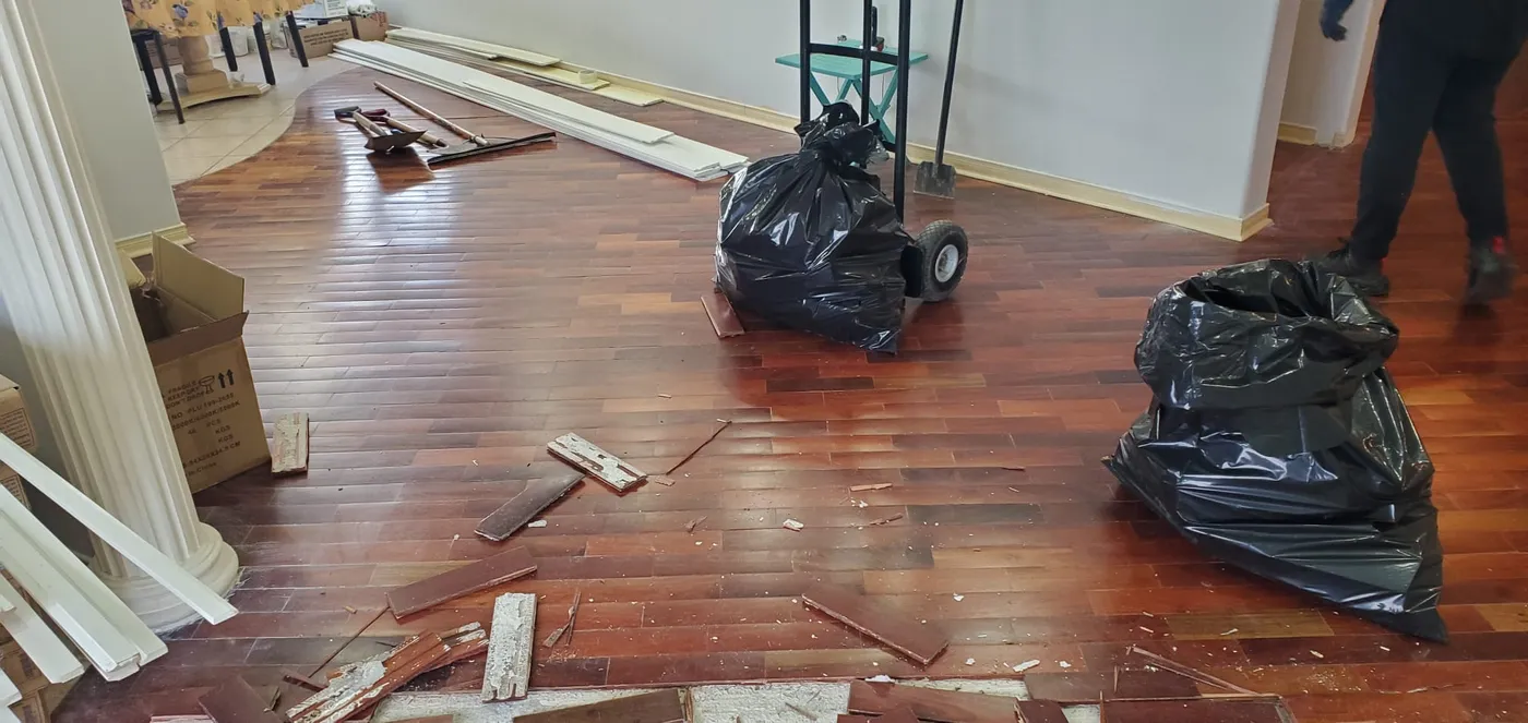 Flooring and materials being cleared from an Oakville home as part of an estate pre-clearance
